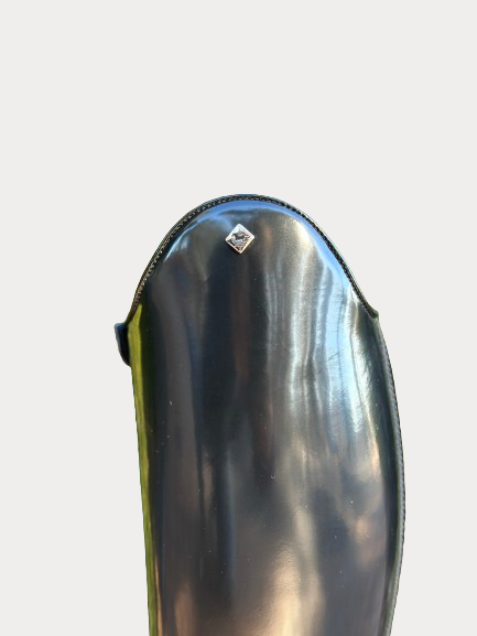 Shiny black leather tall boot with logo on top