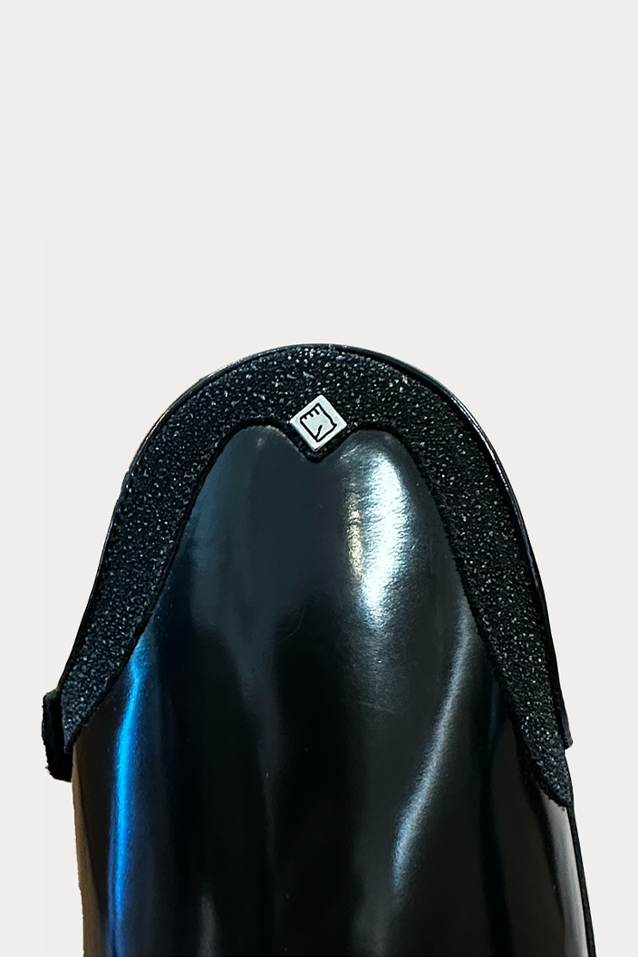 Shiny black tall boot with sparkly top